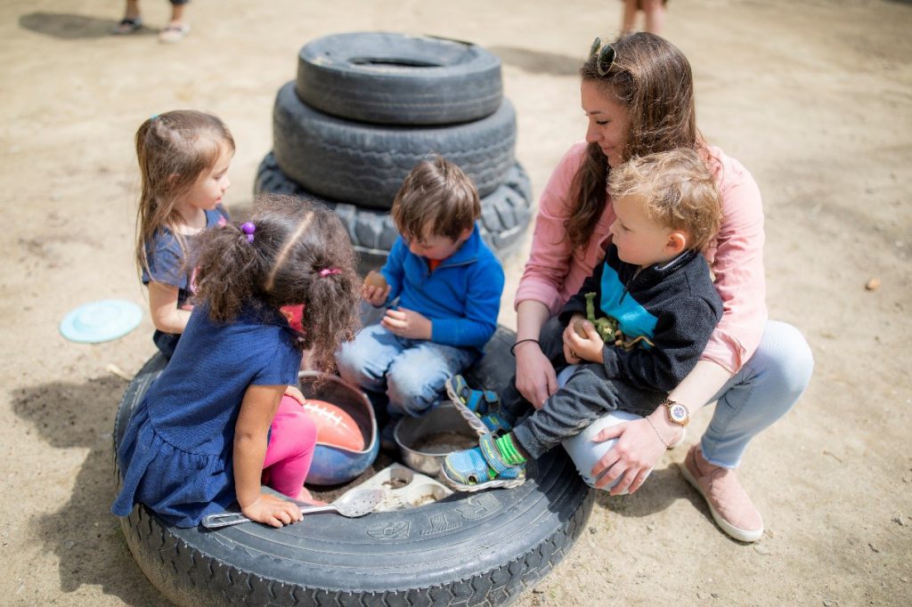 NH teacher with children