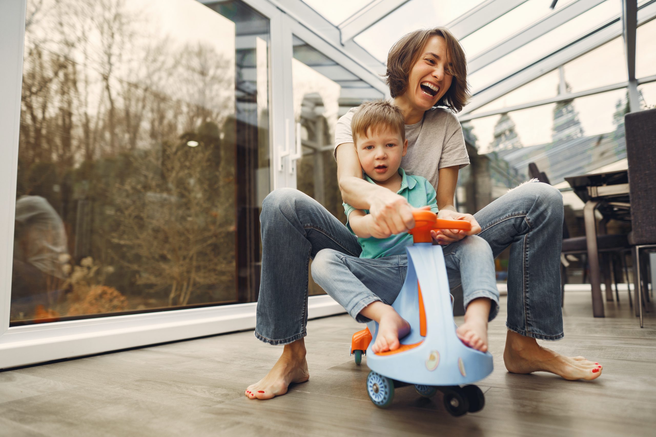 Mom and child playing on scooter